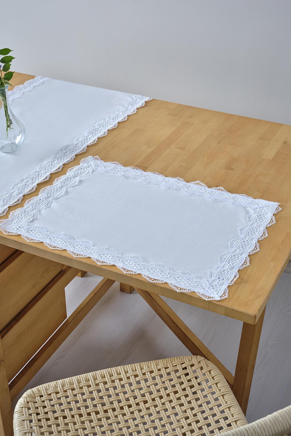 White placemat with lace trim, tablecloth decor on a wooden table and chair