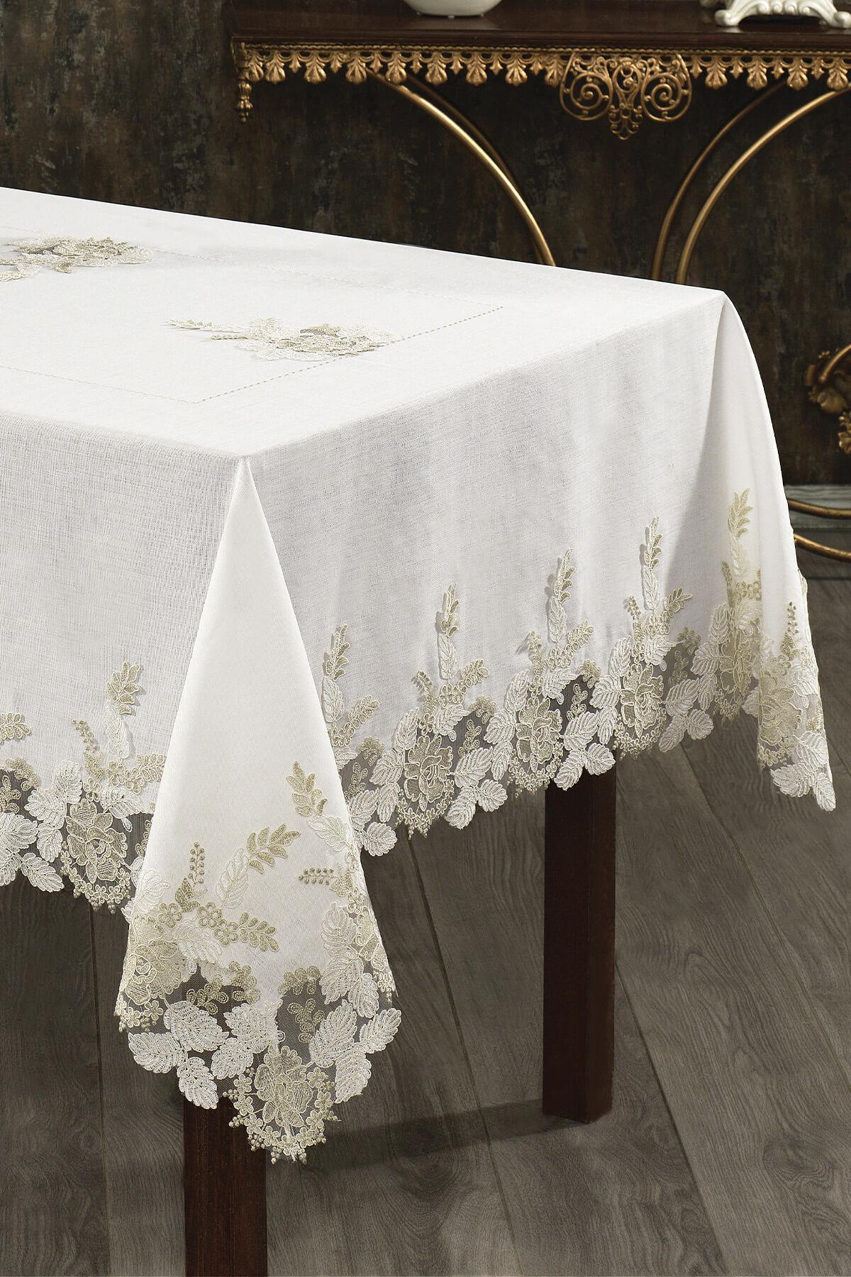 Lace-embroidered, stain-resistant white tablecloth on a rectangular table