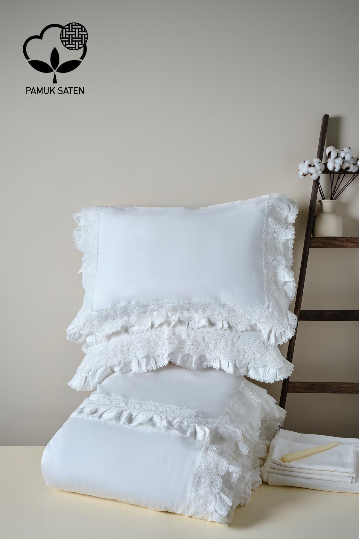 Lace-trimmed white organic cotton sateen double duvet cover set in a decorative bedroom setting