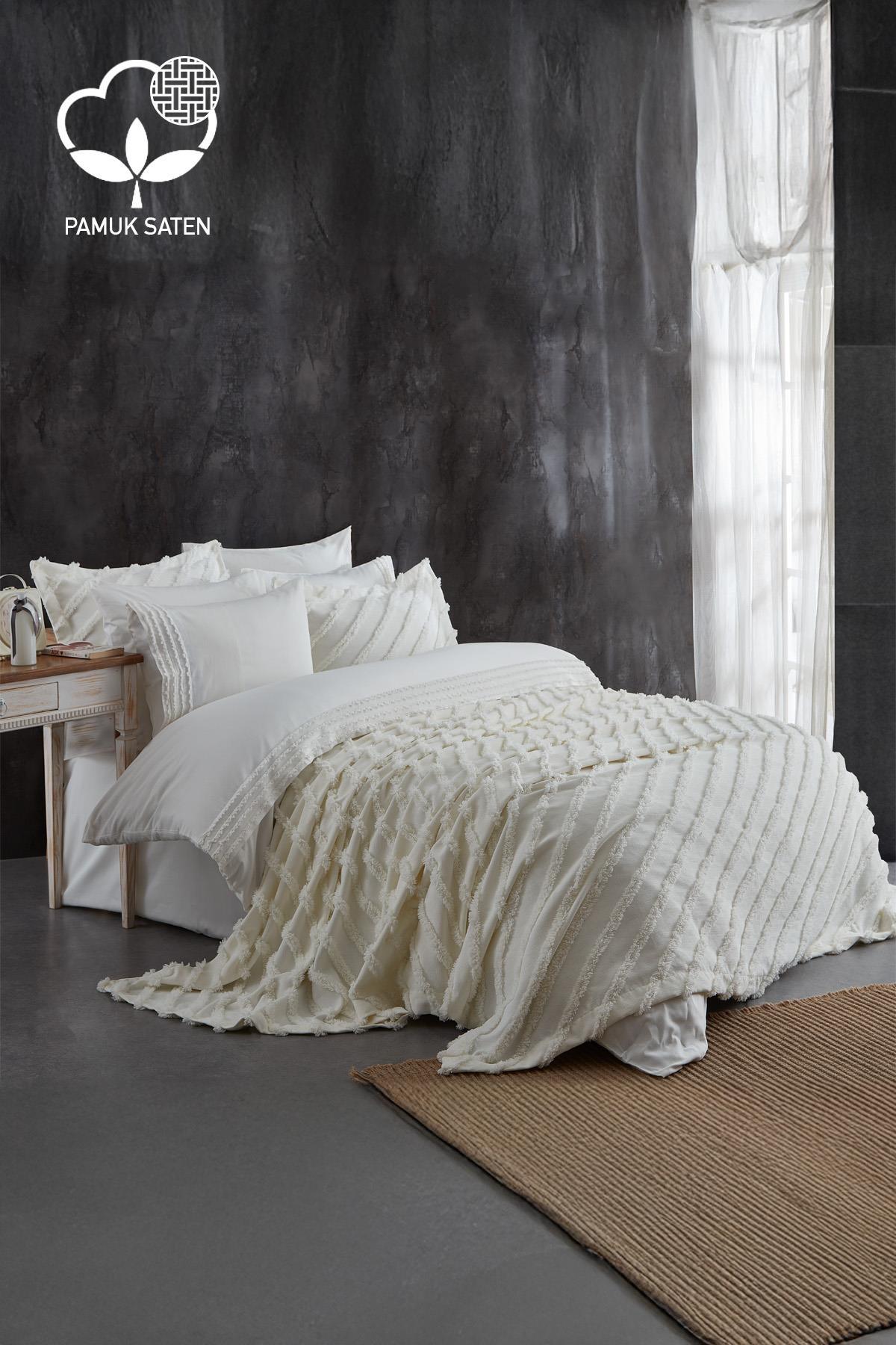 Double-size white cotton sateen duvet cover and bedspread set, laid out in a modern bedroom