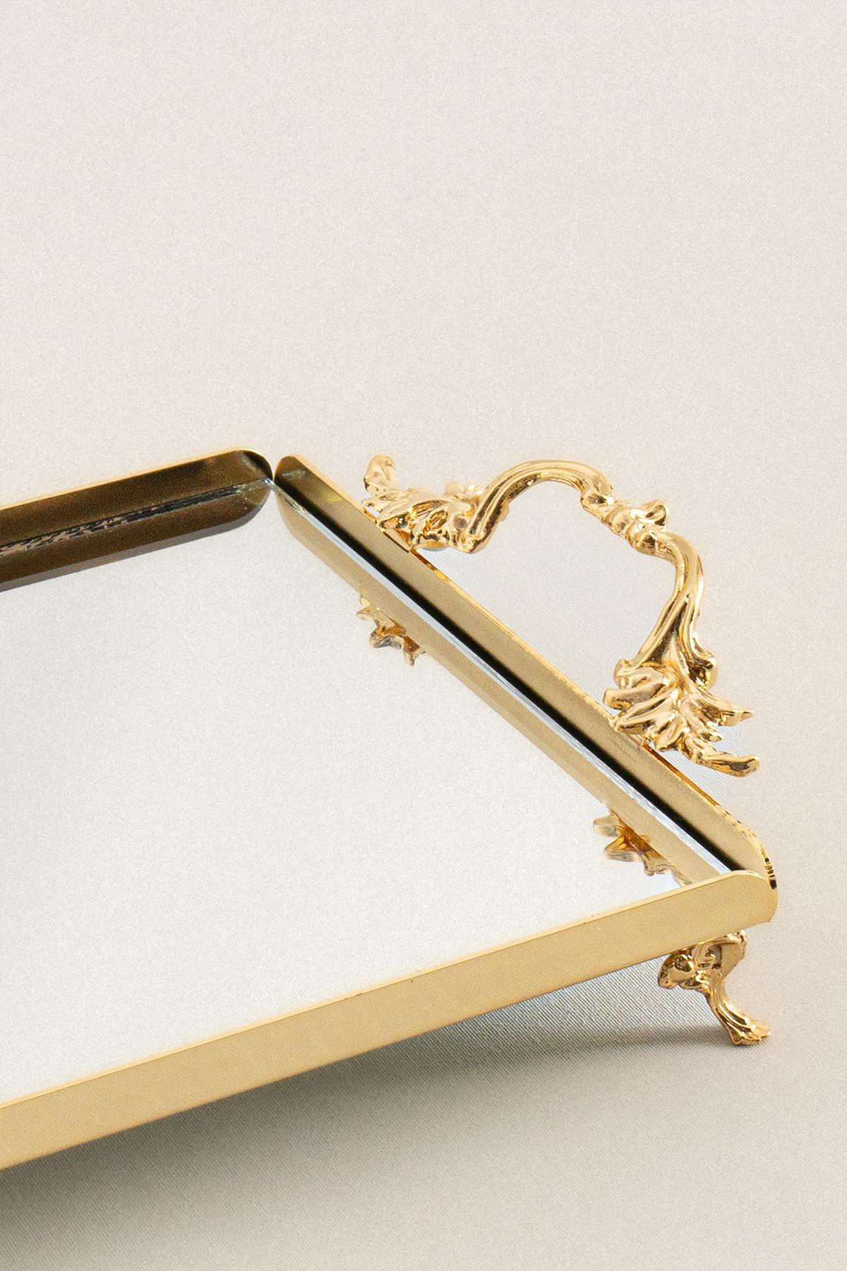 Small rectangular tray with elegant gold-colored handles, featuring a decorative base and a mirrored surface.