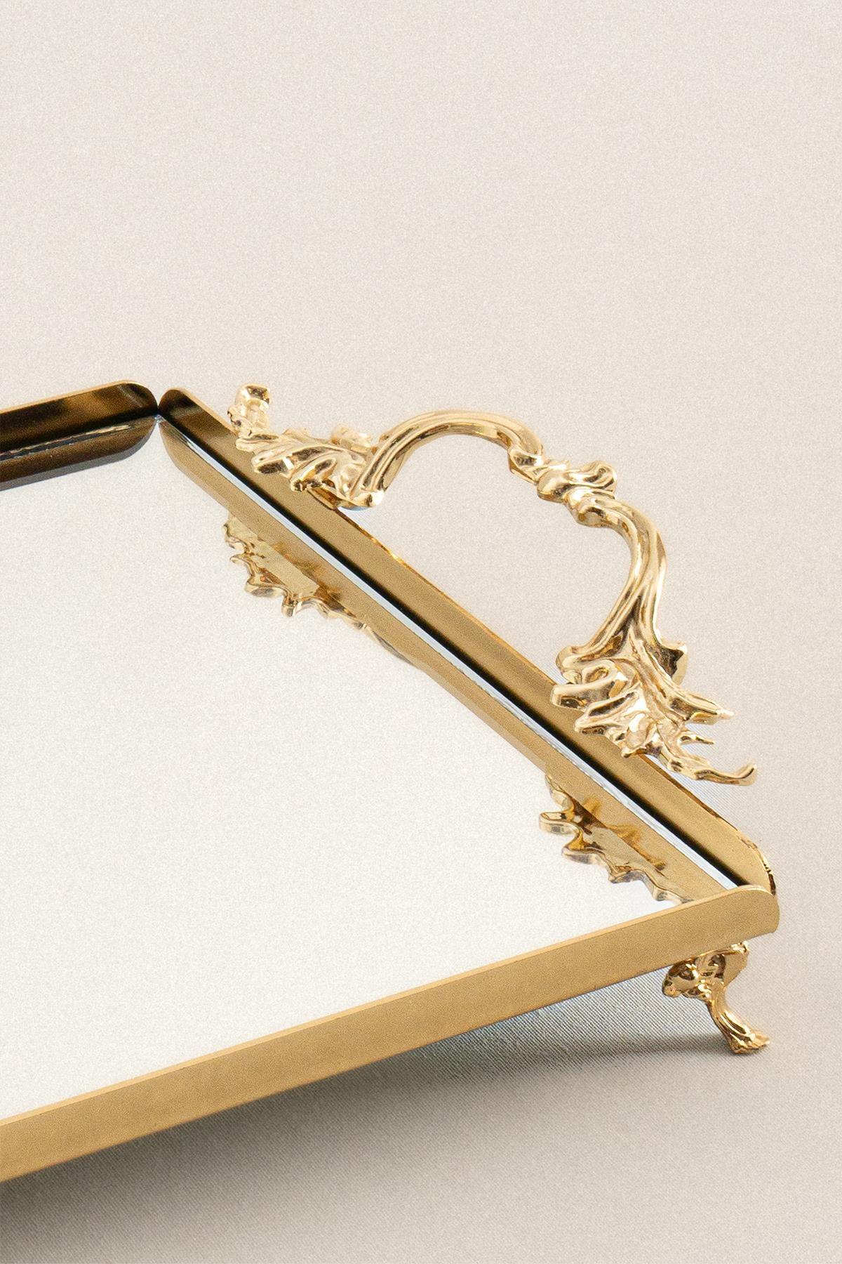 Gold-colored, medium-sized rectangular metal tray with elegant handles and decorative feet