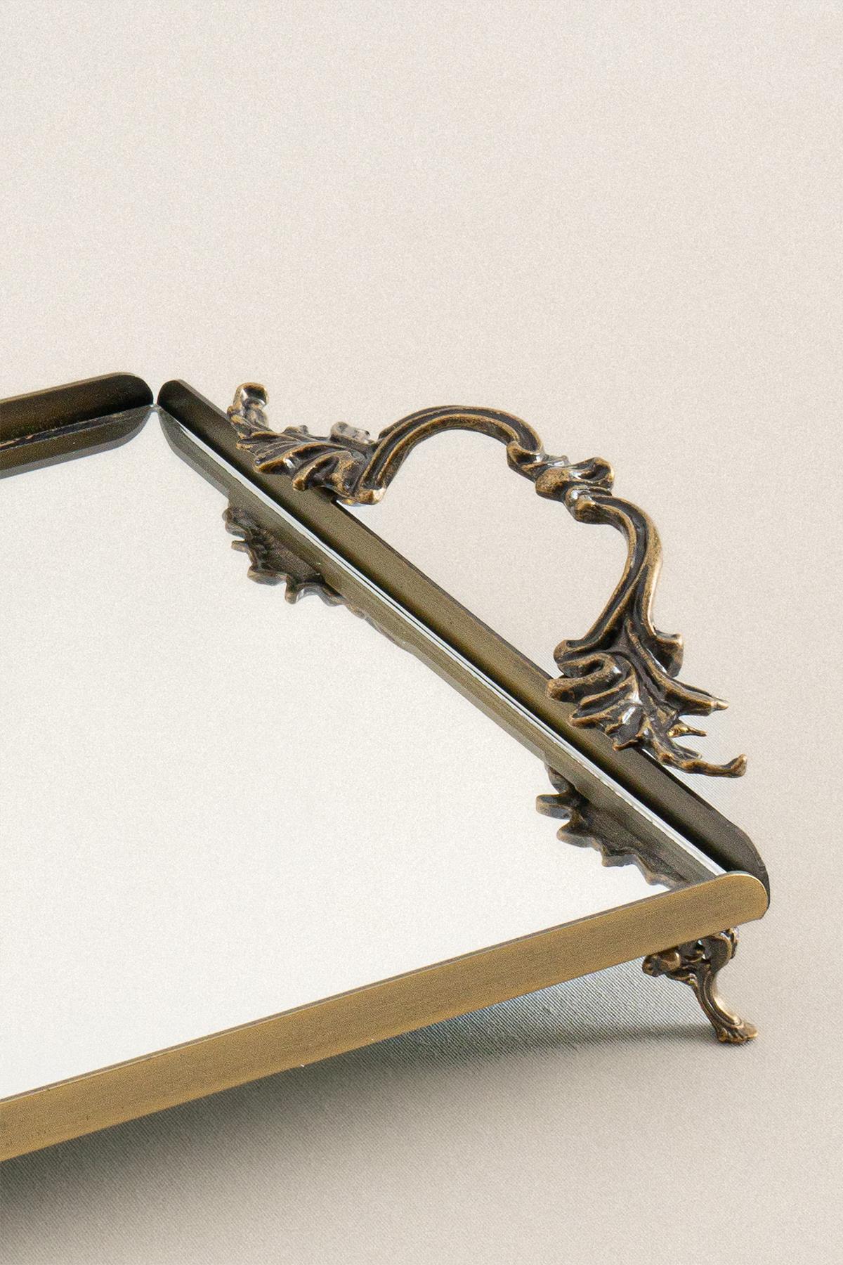 Rectangular tray with an antique finish, elegant metal handles, and a mirrored surface, decorative tray