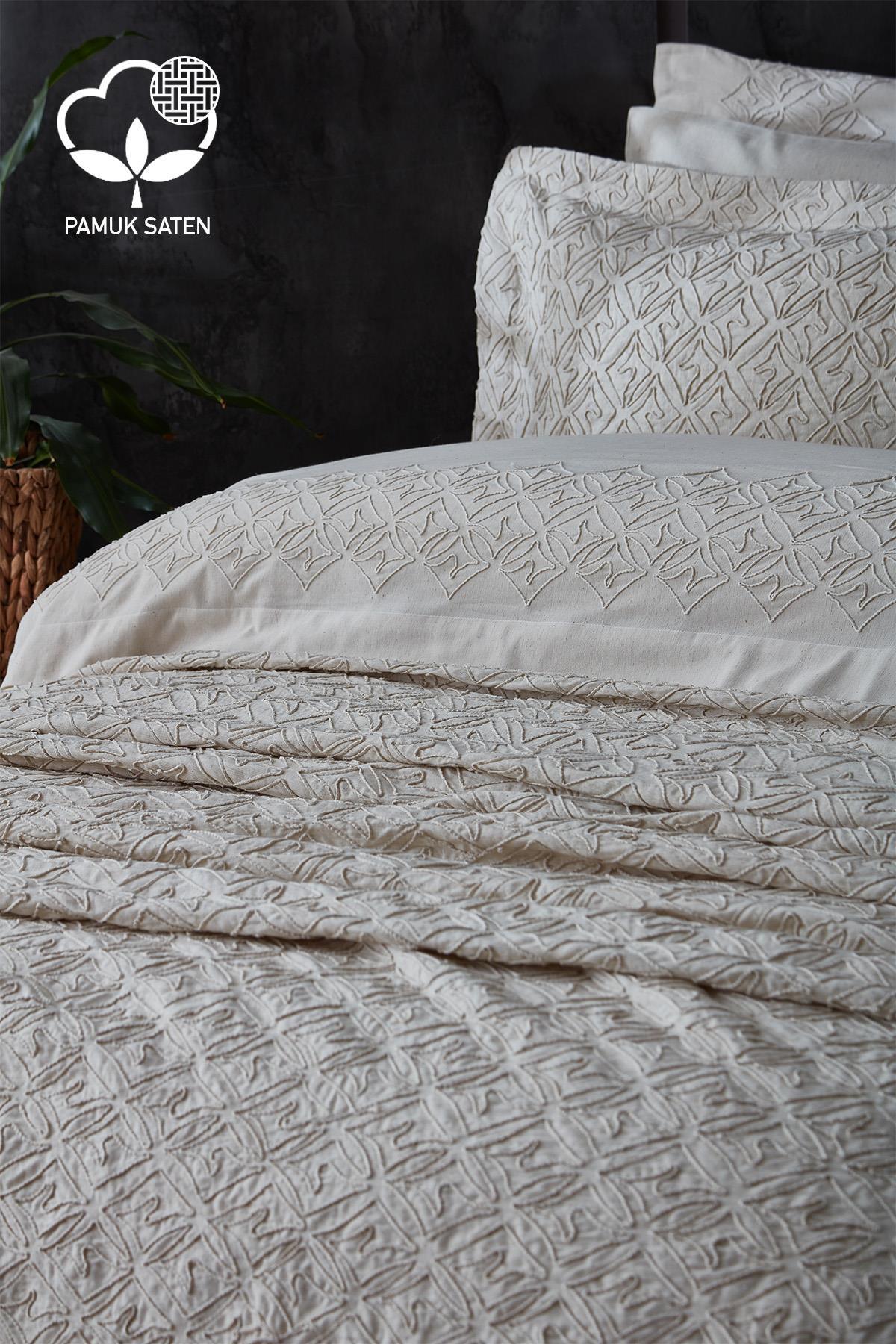 Cream-colored cotton sateen, embroidered double duvet cover and bedspread set, modern bedroom.