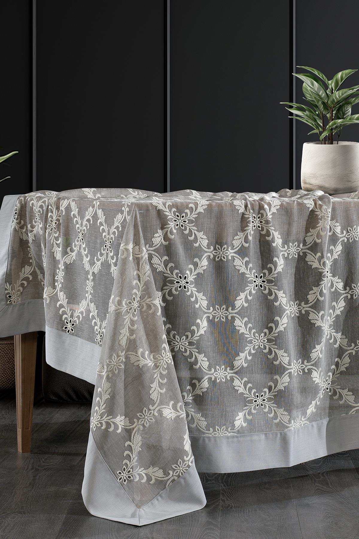 Stain-resistant, easy-care cream patterned tablecloth on a modern dining table