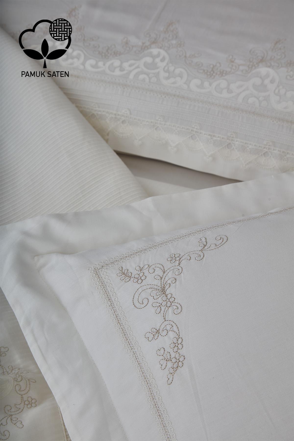 Details of the white double cotton sateen duvet cover and bedspread set with ruby embroidery