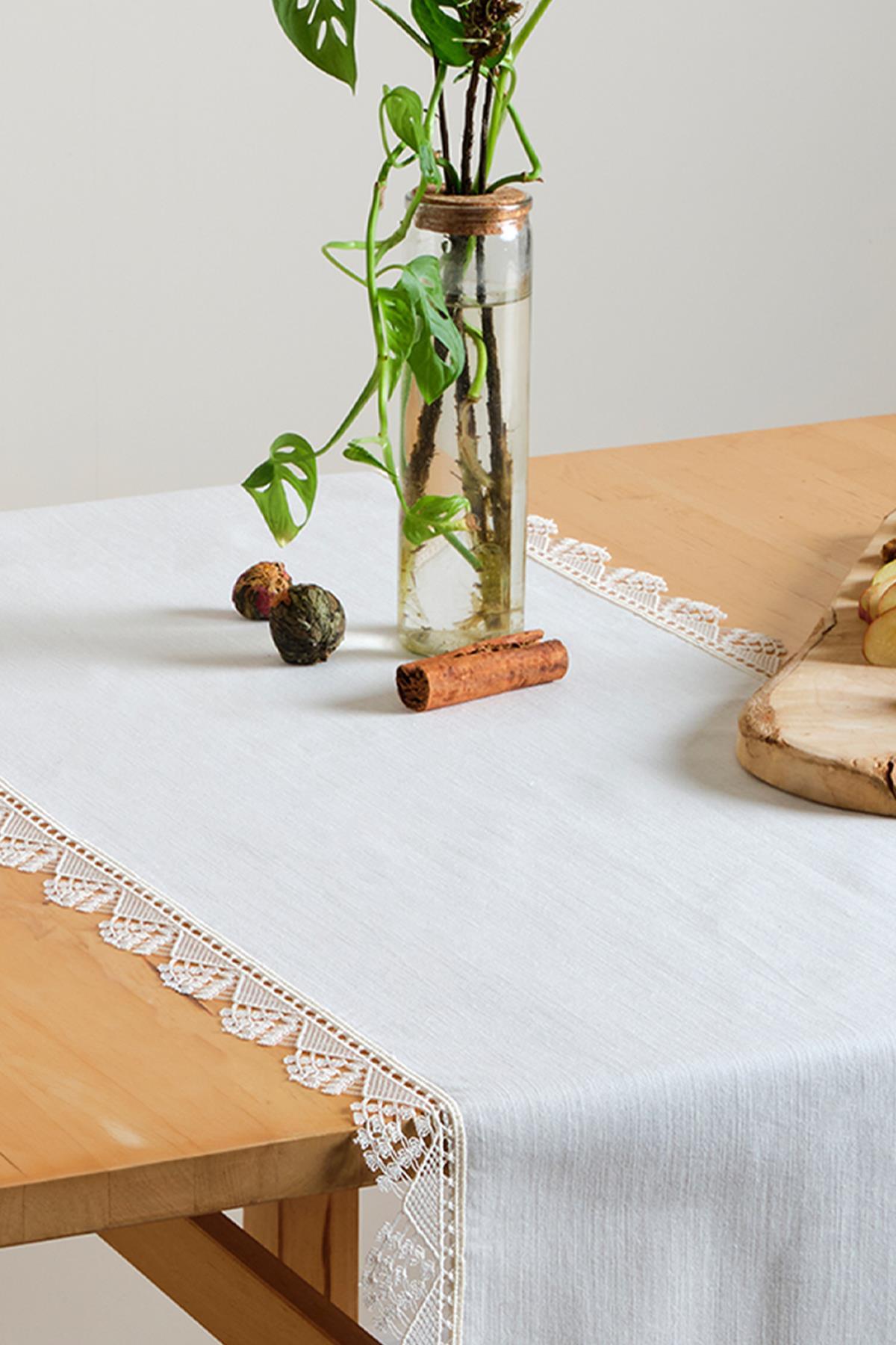 White lace table runner, elegant table decoration on a wooden table, 40x140 cm tablecloth