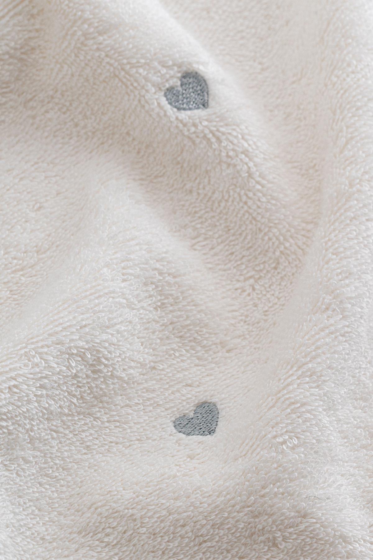 White soft towel with gray heart pattern, for a comfortable and stylish life
