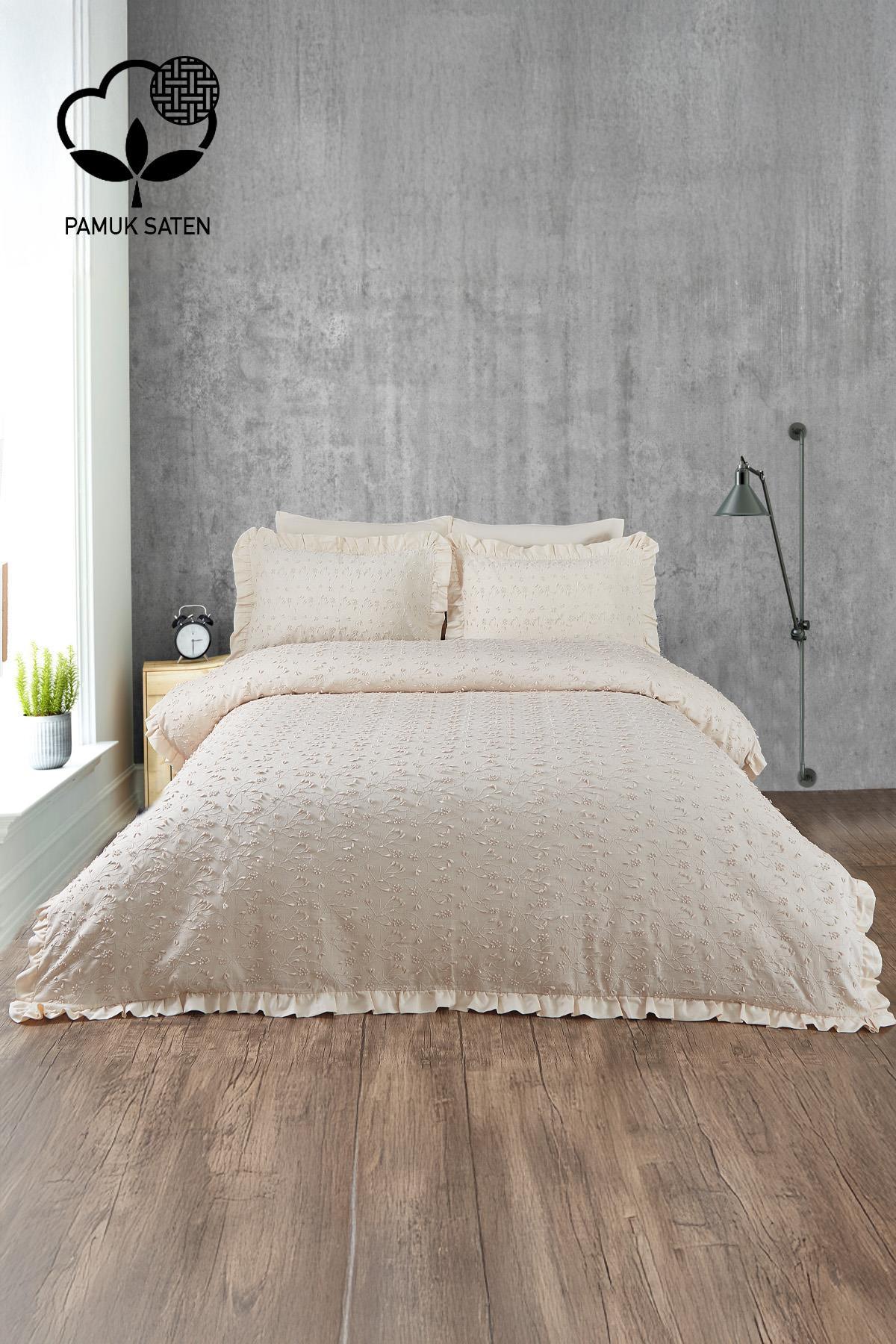 Beige embroidered cotton sateen double duvet cover set in a modern bedroom