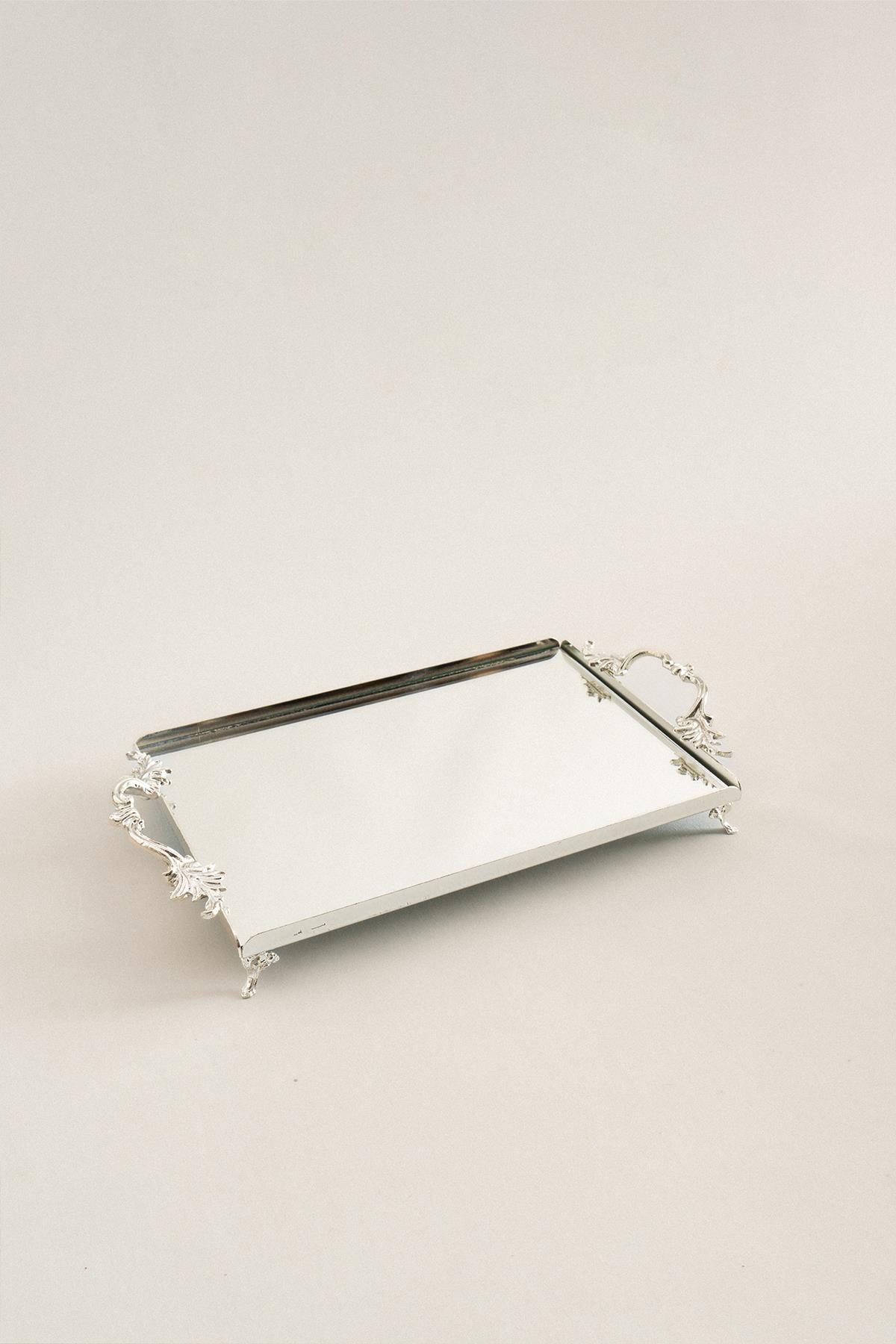 Silver-colored rectangular metal tray with elegant handles, medium-sized with a mirrored base, 32x22 cm.