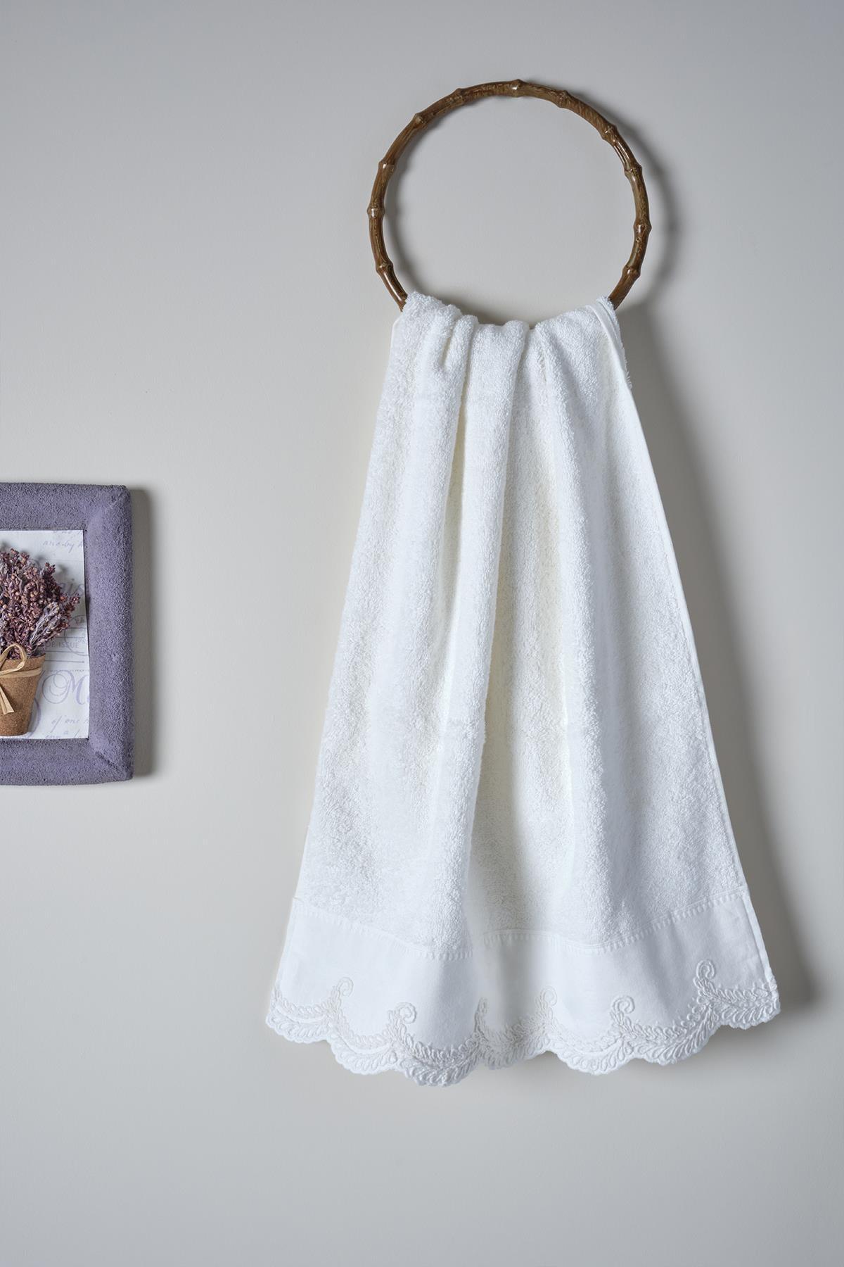 White lace-embroidered bath towel, 90x150 cm, hanging on the wall, bathroom decor